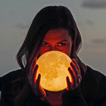 woman holding moon orb
